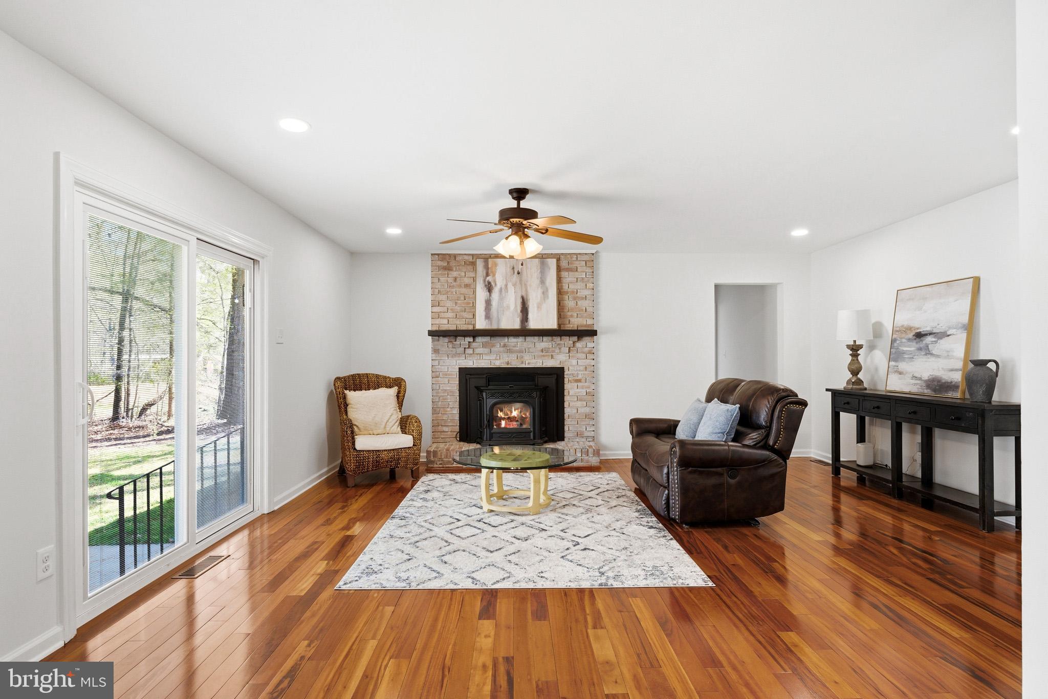7219 Carrico Mill Road Hughesville, MD 20637 - Photo 14 of 41 a living room with furniture and a fireplace