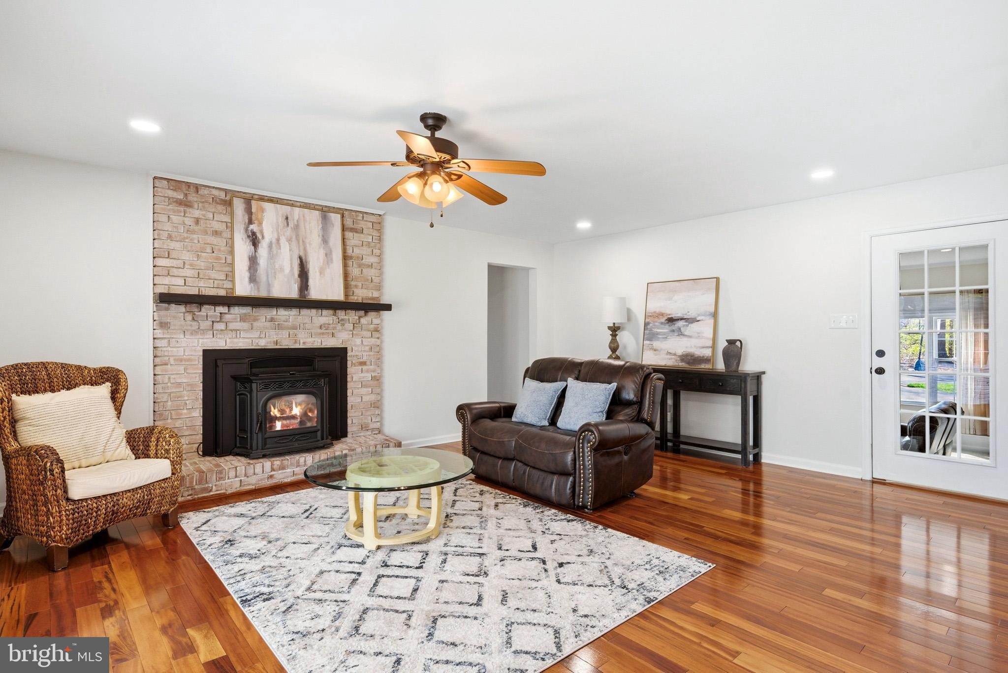 7219 Carrico Mill Road Hughesville, MD 20637 - Photo 15 of 41 a living room with furniture and a fireplace