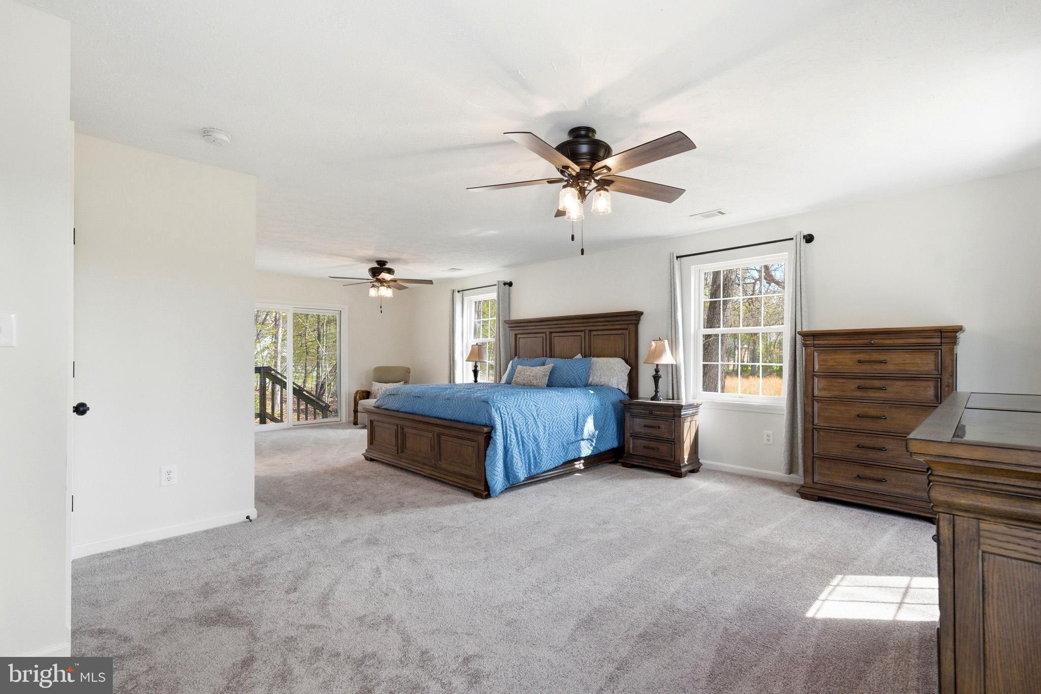 7219 Carrico Mill Road Hughesville, MD 20637 - Photo 18 of 41 a bedroom with a bed dresser and a window