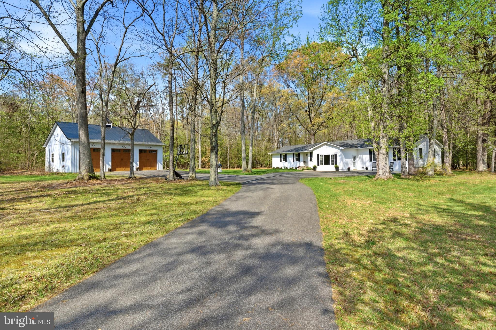 7219 Carrico Mill Road Hughesville, MD 20637 - Photo 2 of 41 a house view with swimming pool in front of it
