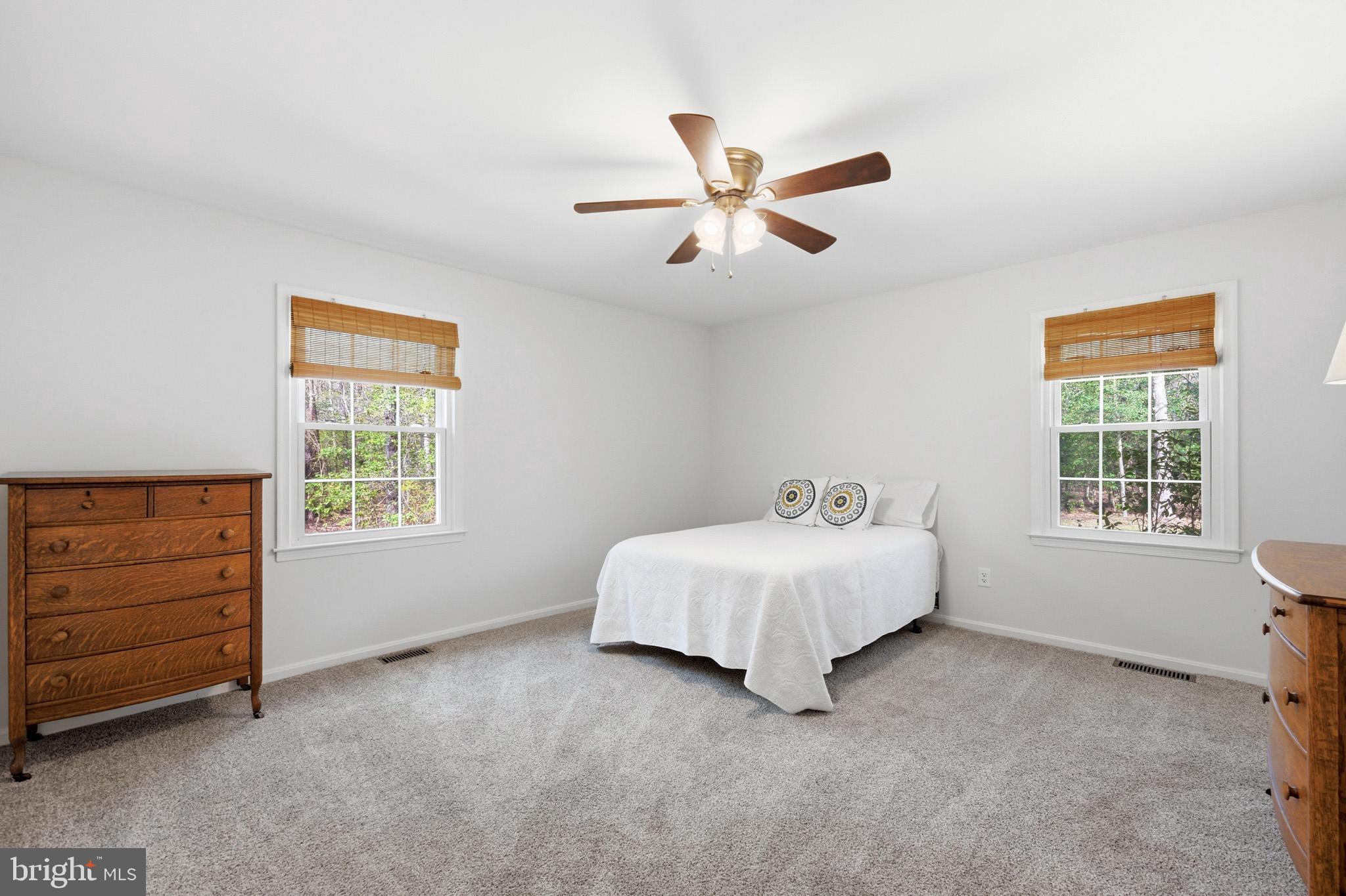 7219 Carrico Mill Road Hughesville, MD 20637 - Photo 22 of 41 a spacious bedroom with a bed and a window