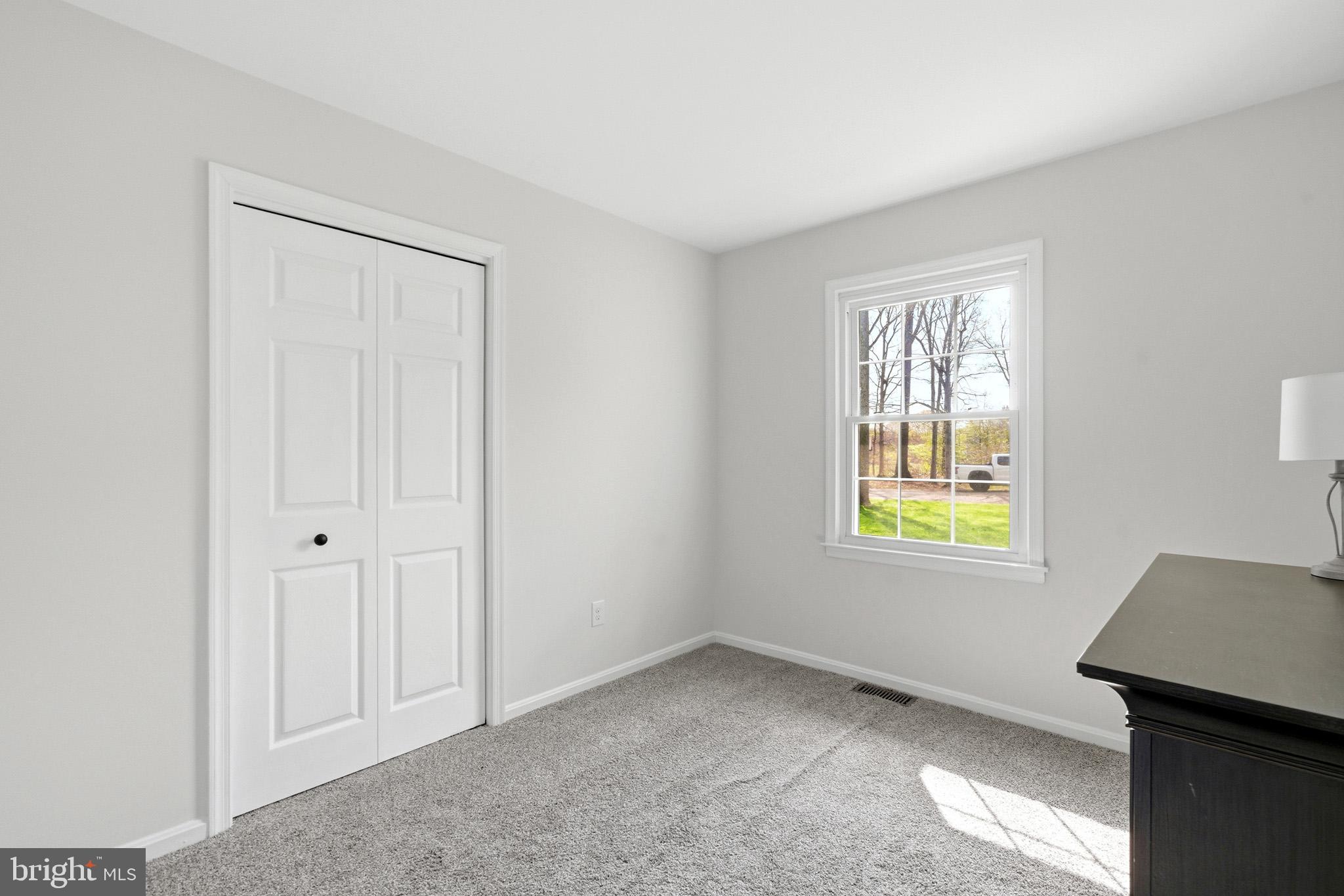 7219 Carrico Mill Road Hughesville, MD 20637 - Photo 27 of 41 an empty room with windows