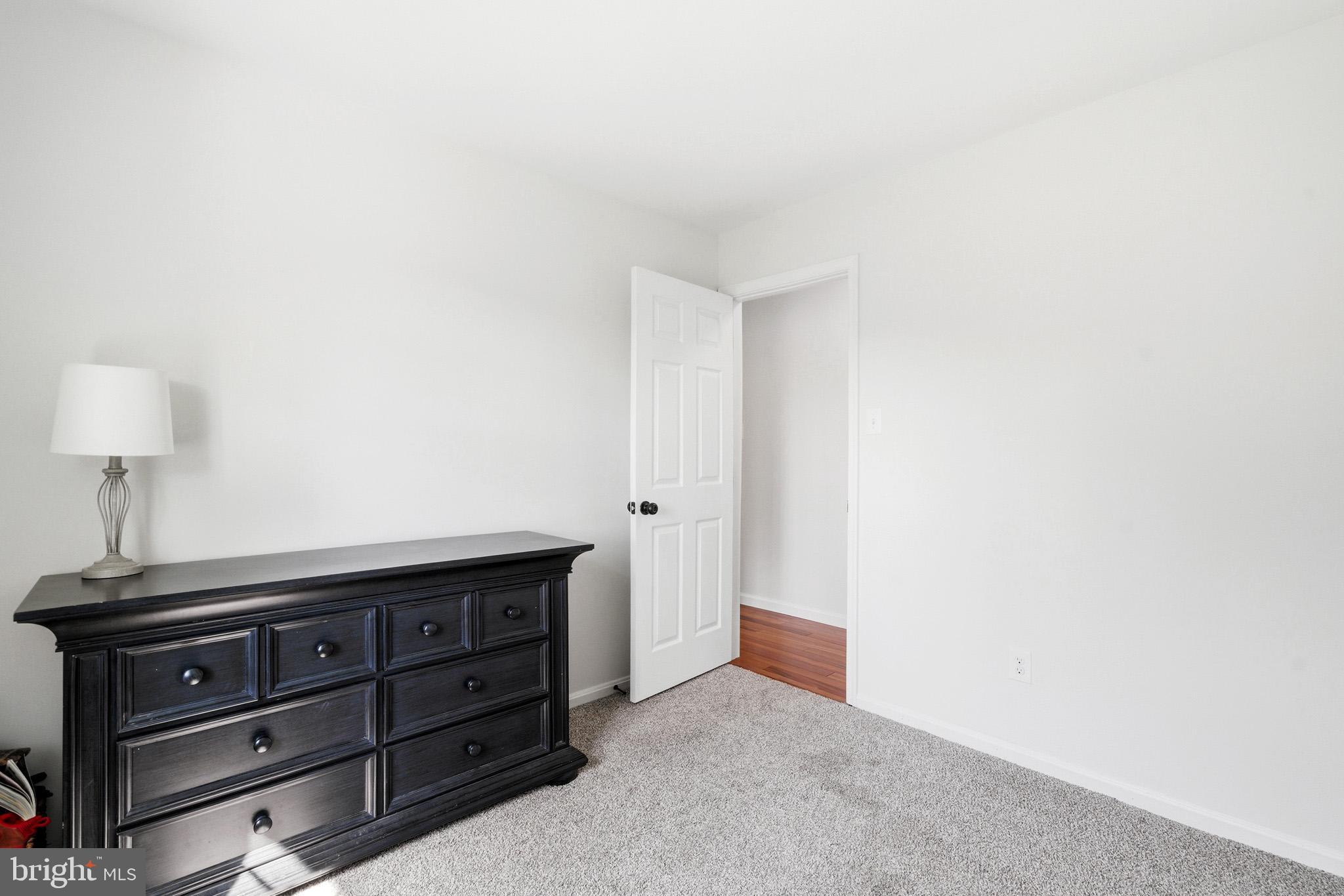 7219 Carrico Mill Road Hughesville, MD 20637 - Photo 28 of 41 a room with a dresser and a night stand