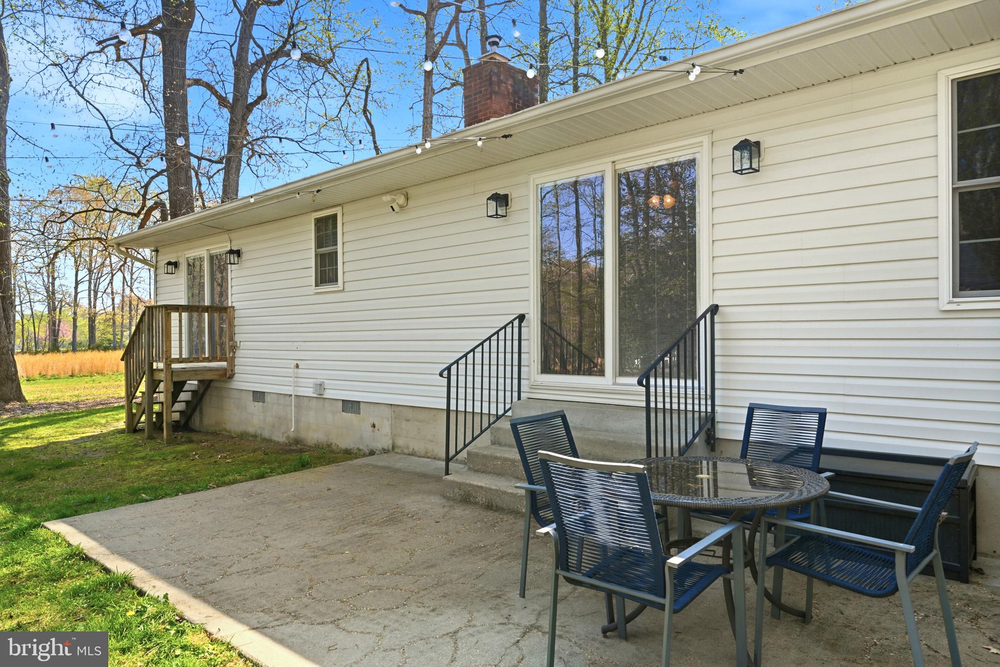 7219 Carrico Mill Road Hughesville, MD 20637 - Photo 32 of 41 a view of backyard of house with seating space