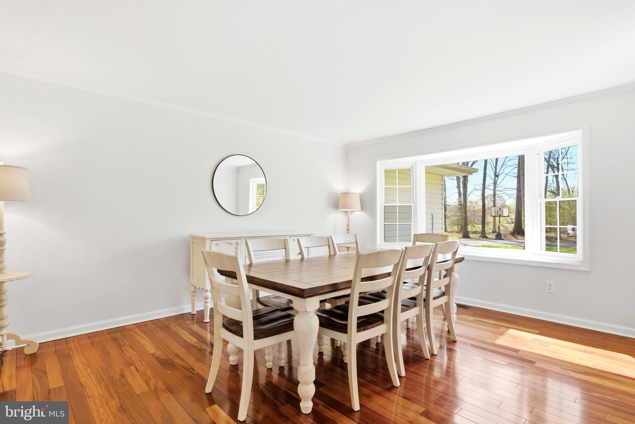 7219 Carrico Mill Road Hughesville, MD 20637 - Photo 7 of 41 a view of a dining room with furniture and wooden floor