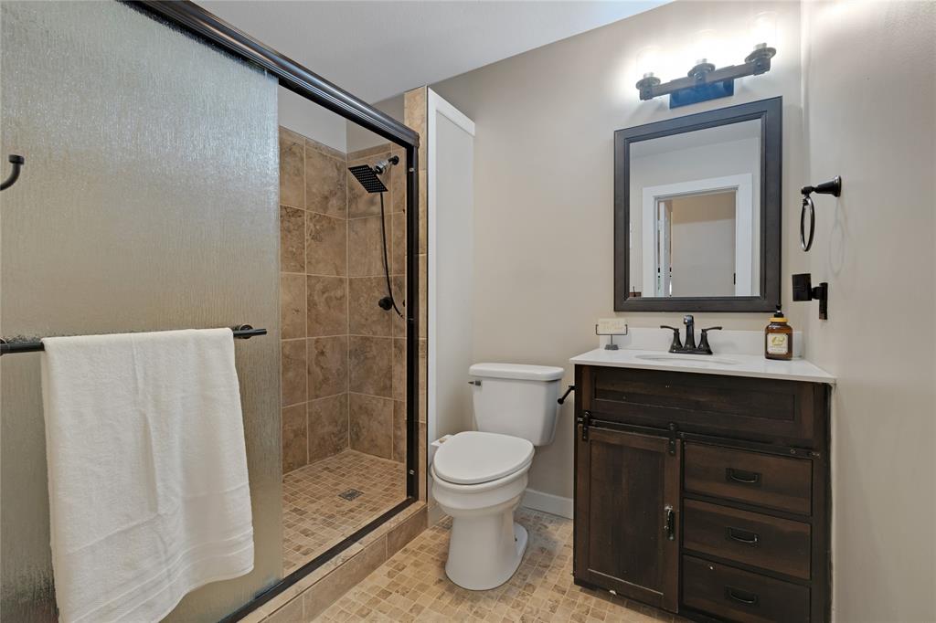 11061 Foutch Road Pilot Point, TX 76258 - Photo 20 of 37 Main floor bathroom is perfect for guests, and it is in close proximity to the main floor bedroom.
