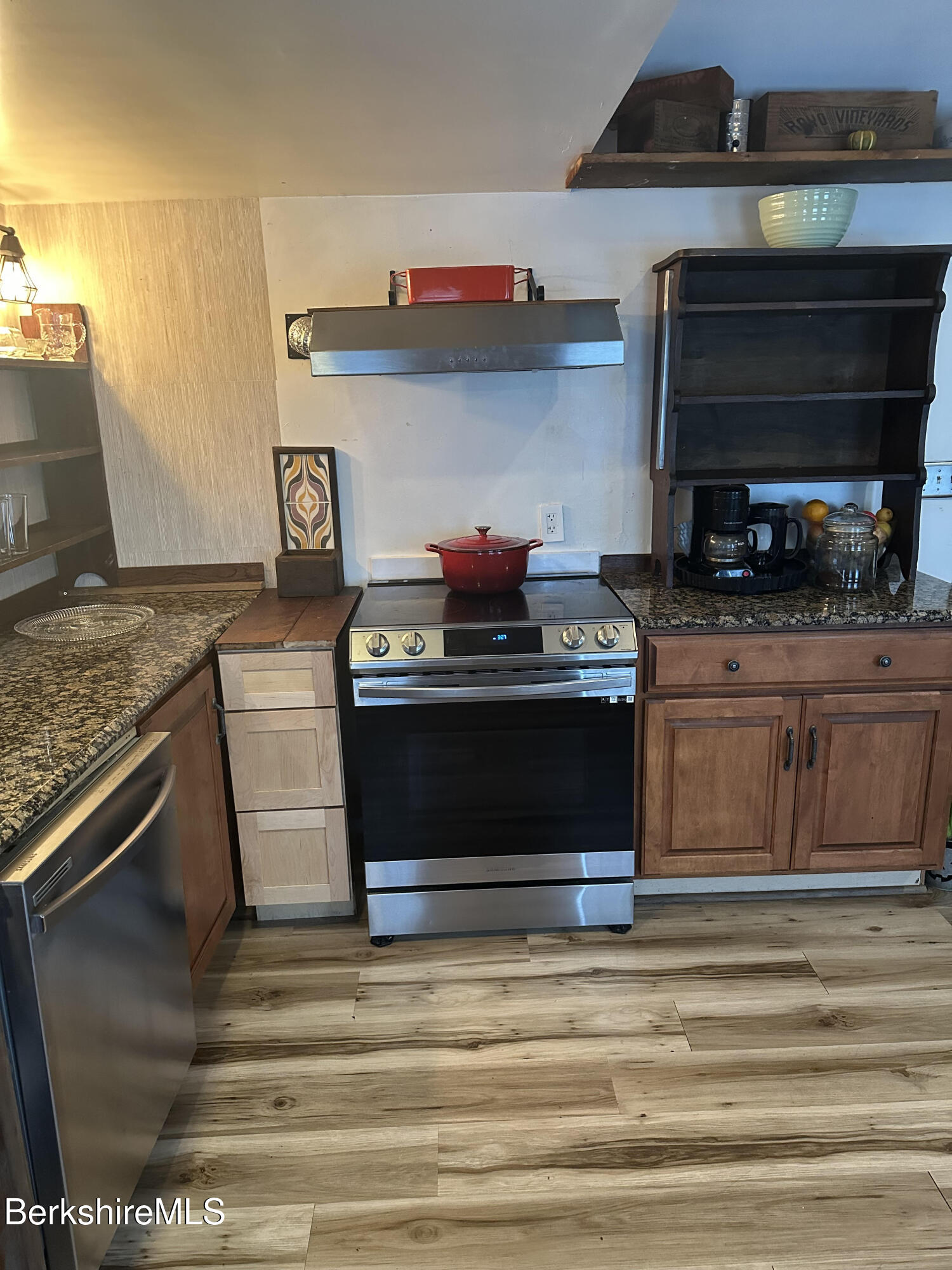 27 North Main Road Otis, MA 01253 - Photo 6 of 24 a kitchen with stainless steel appliances granite countertop a stove and a microwave