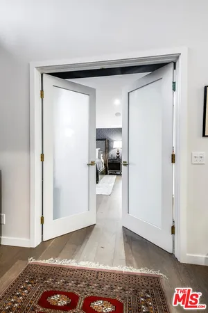 a spacious bathroom with a granite countertop sink and a large mirror