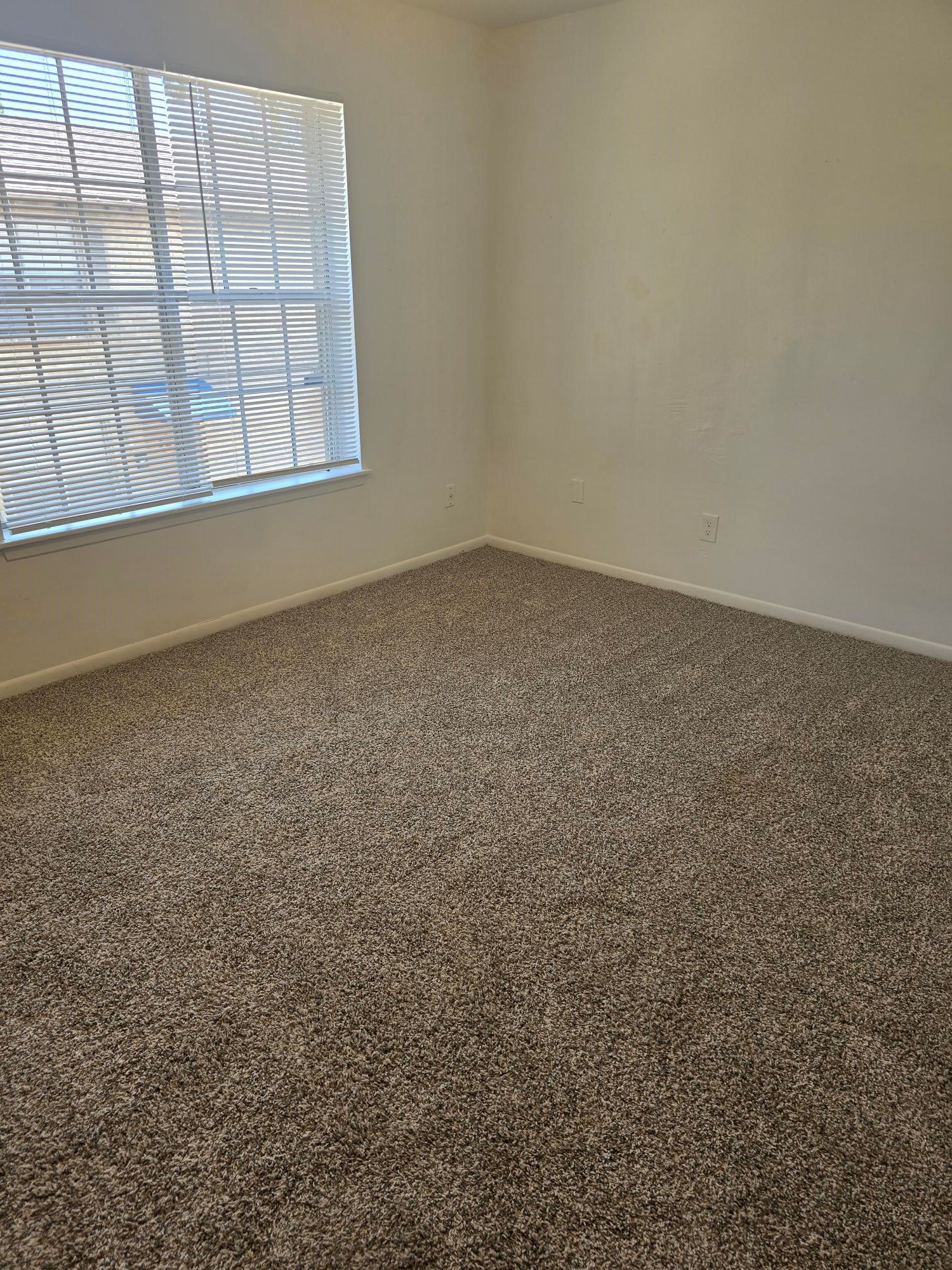 600 Hilliard Street, Unit 2 Conroe, TX 77301 - Photo 14 of 21 an empty room with a empty space and windows