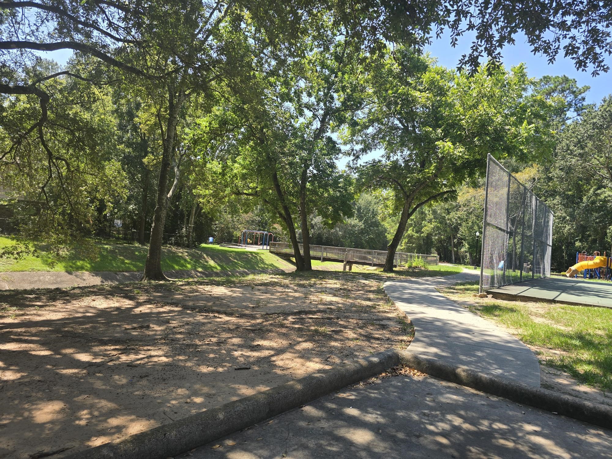600 Hilliard Street, Unit 2 Conroe, TX 77301 - Photo 19 of 21 a view of a yard with a tree