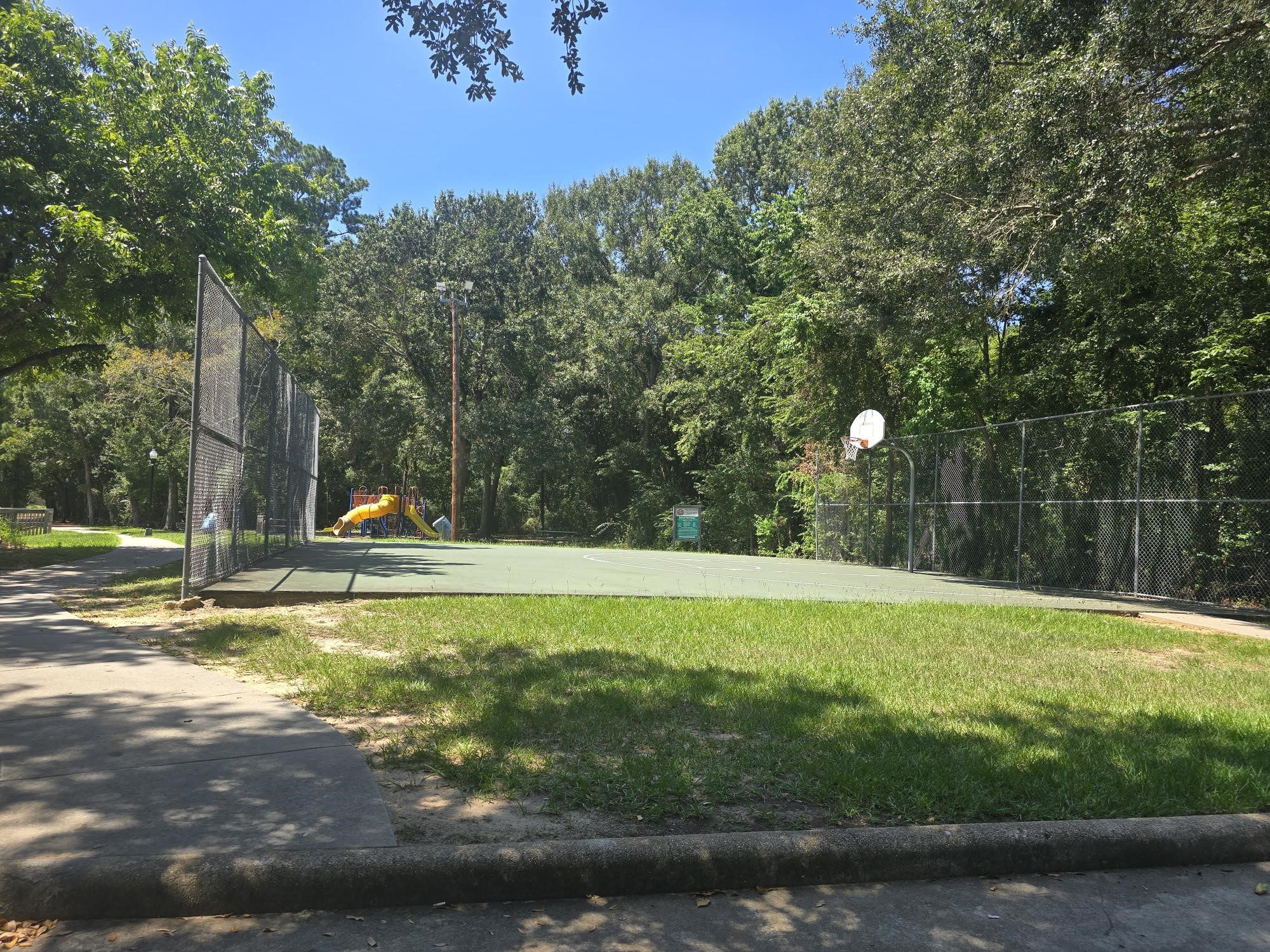 600 Hilliard Street, Unit 2 Conroe, TX 77301 - Photo 21 of 21 a view of a pool with a yard