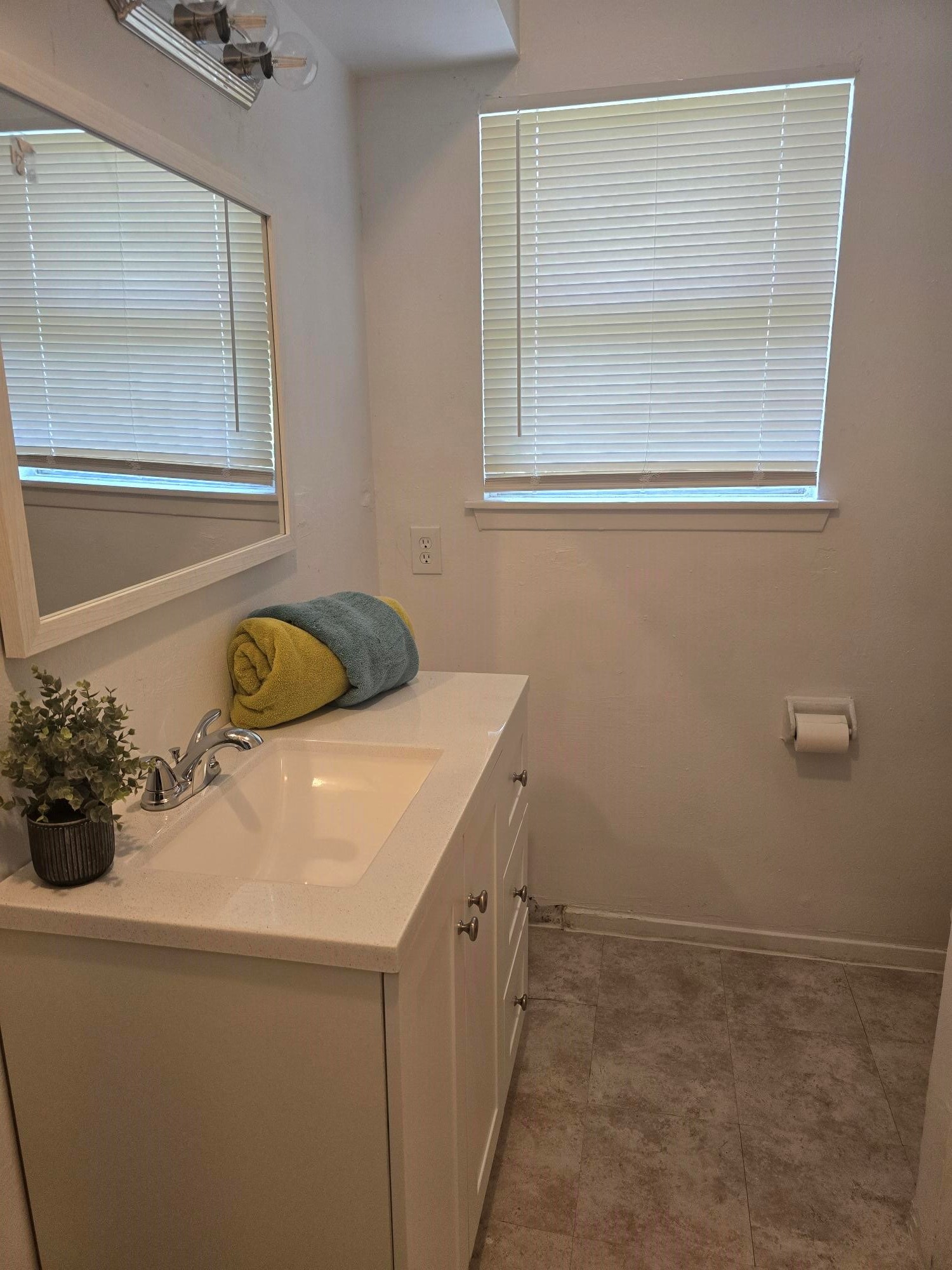 600 Hilliard Street, Unit 2 Conroe, TX 77301 - Photo 8 of 21 a bathroom with a sink and a mirror
