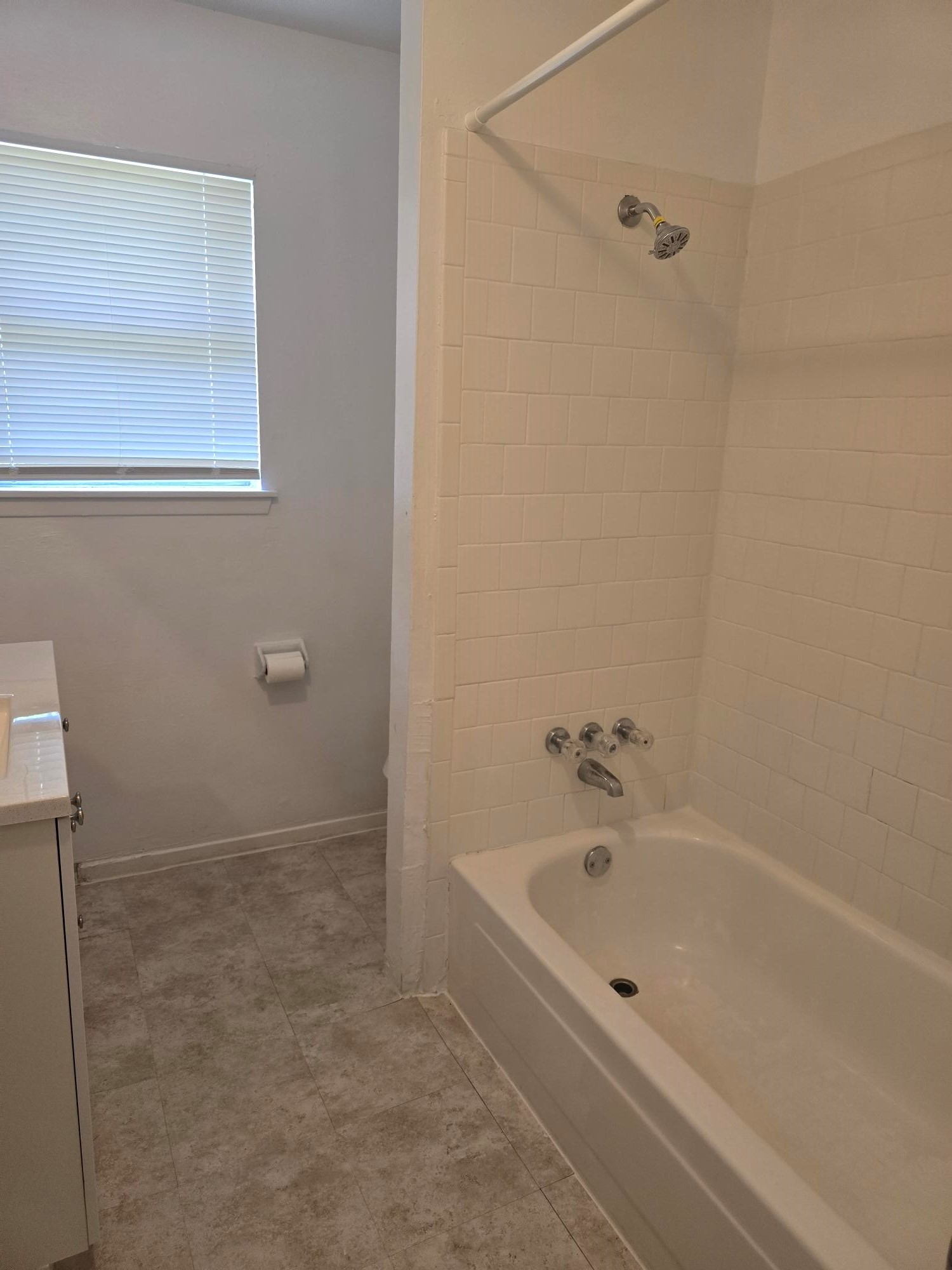 600 Hilliard Street, Unit 2 Conroe, TX 77301 - Photo 9 of 21 a bathroom with a bathtub