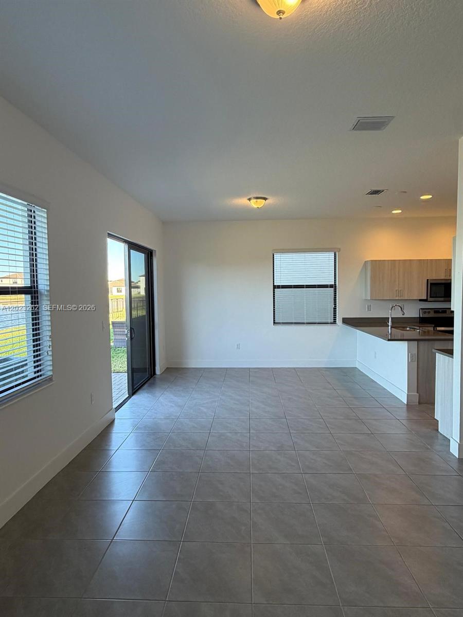 5669 Cerva Lane, Unit 5669 Immokalee, FL 34142 - Photo 24 of 32 a view of an empty room with a window