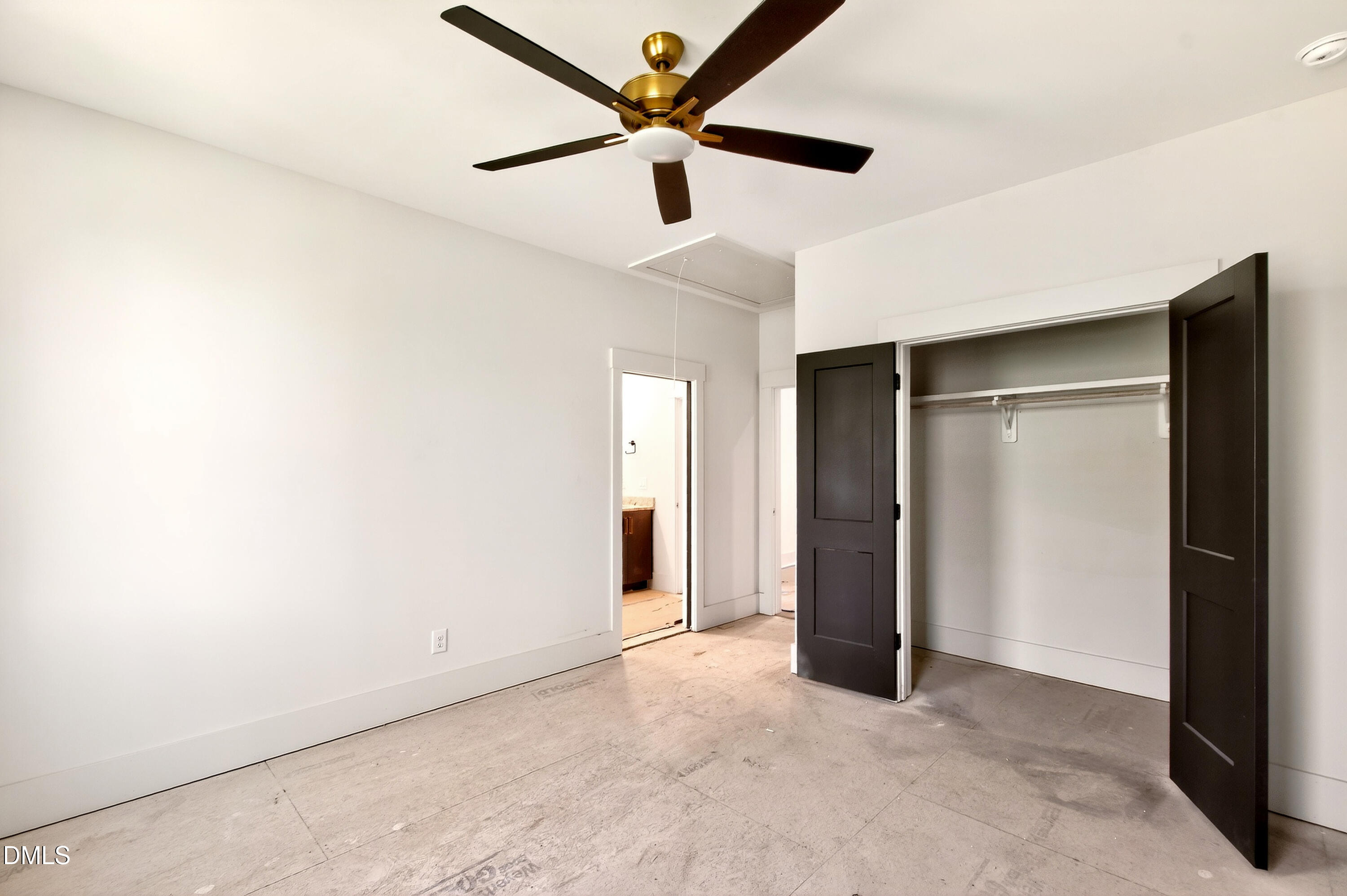 909 Oberlin Road Raleigh, NC 27605 - Photo 29 of 59 an empty room with closet and a ceiling fan