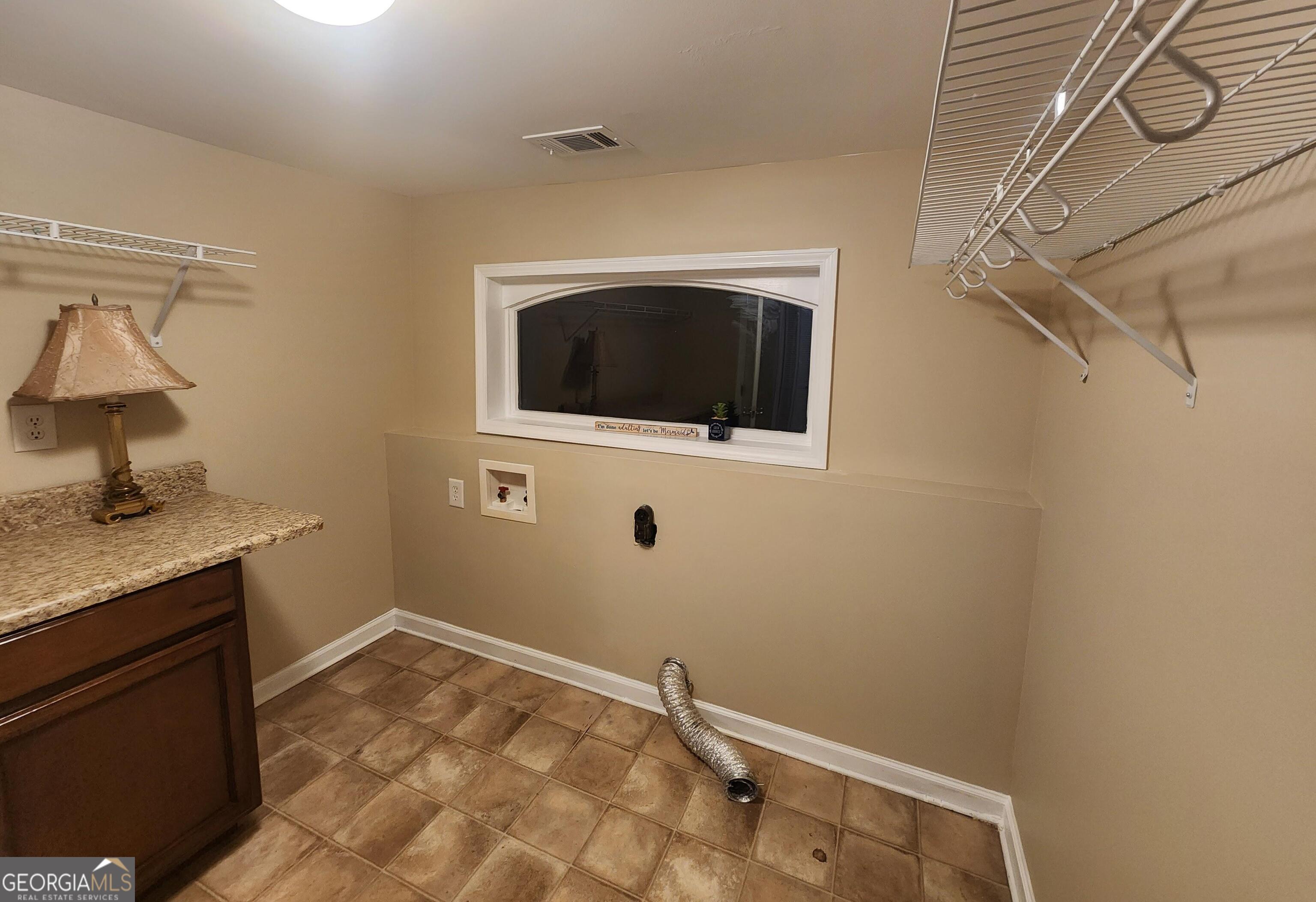 2125 Westbrook Road Commerce, GA 30530 - Photo 12 of 25 a bathroom with a sink and vanity