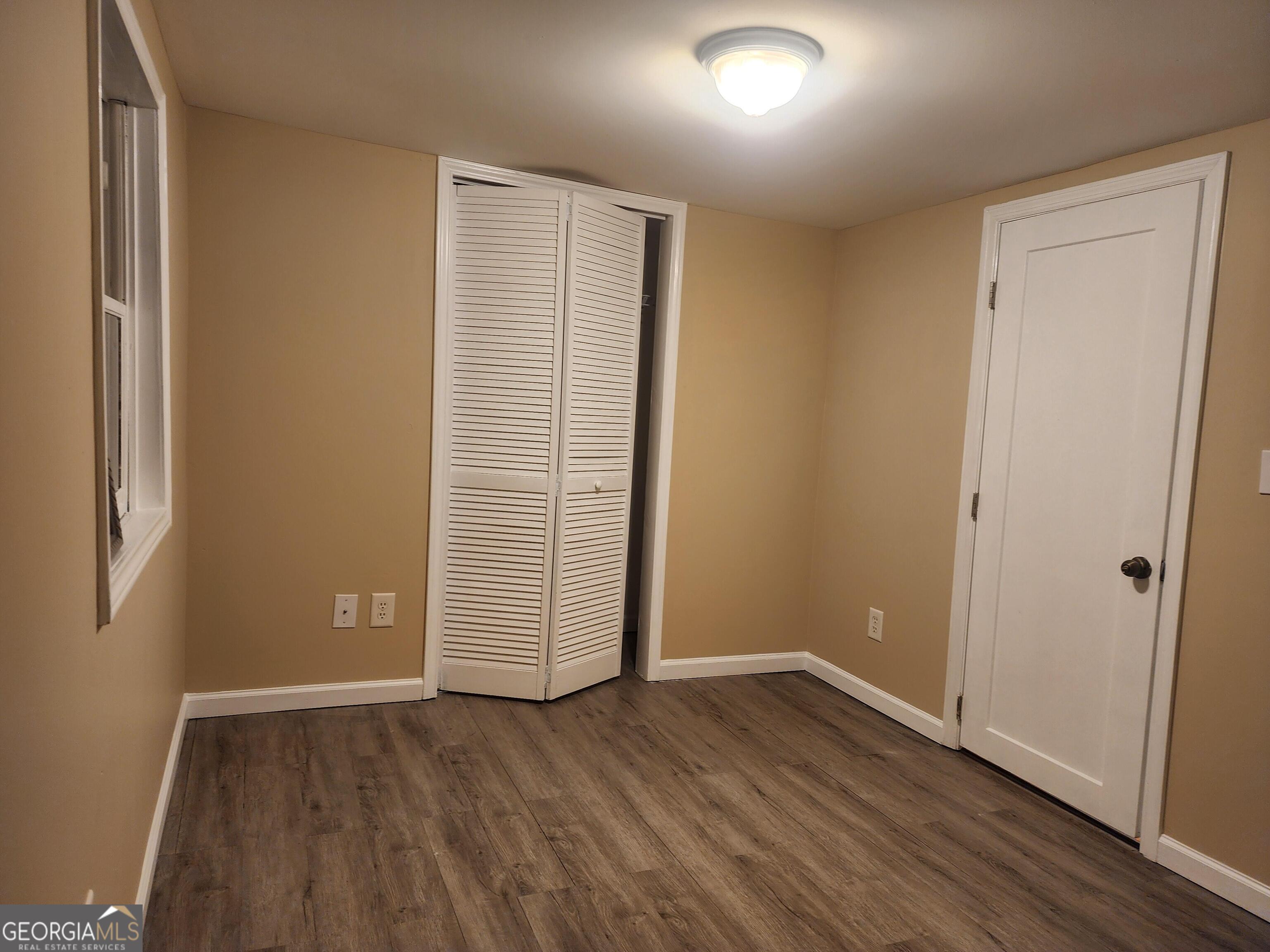 2125 Westbrook Road Commerce, GA 30530 - Photo 13 of 25 an empty room with wooden floor and windows