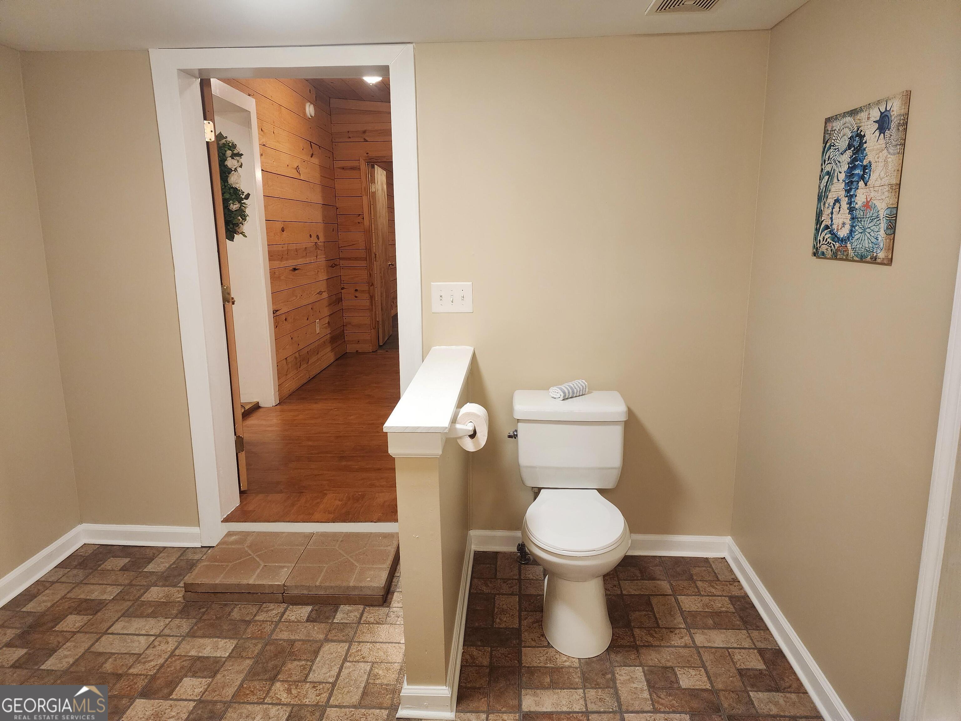2125 Westbrook Road Commerce, GA 30530 - Photo 21 of 25 a bathroom with a toilet and a shower
