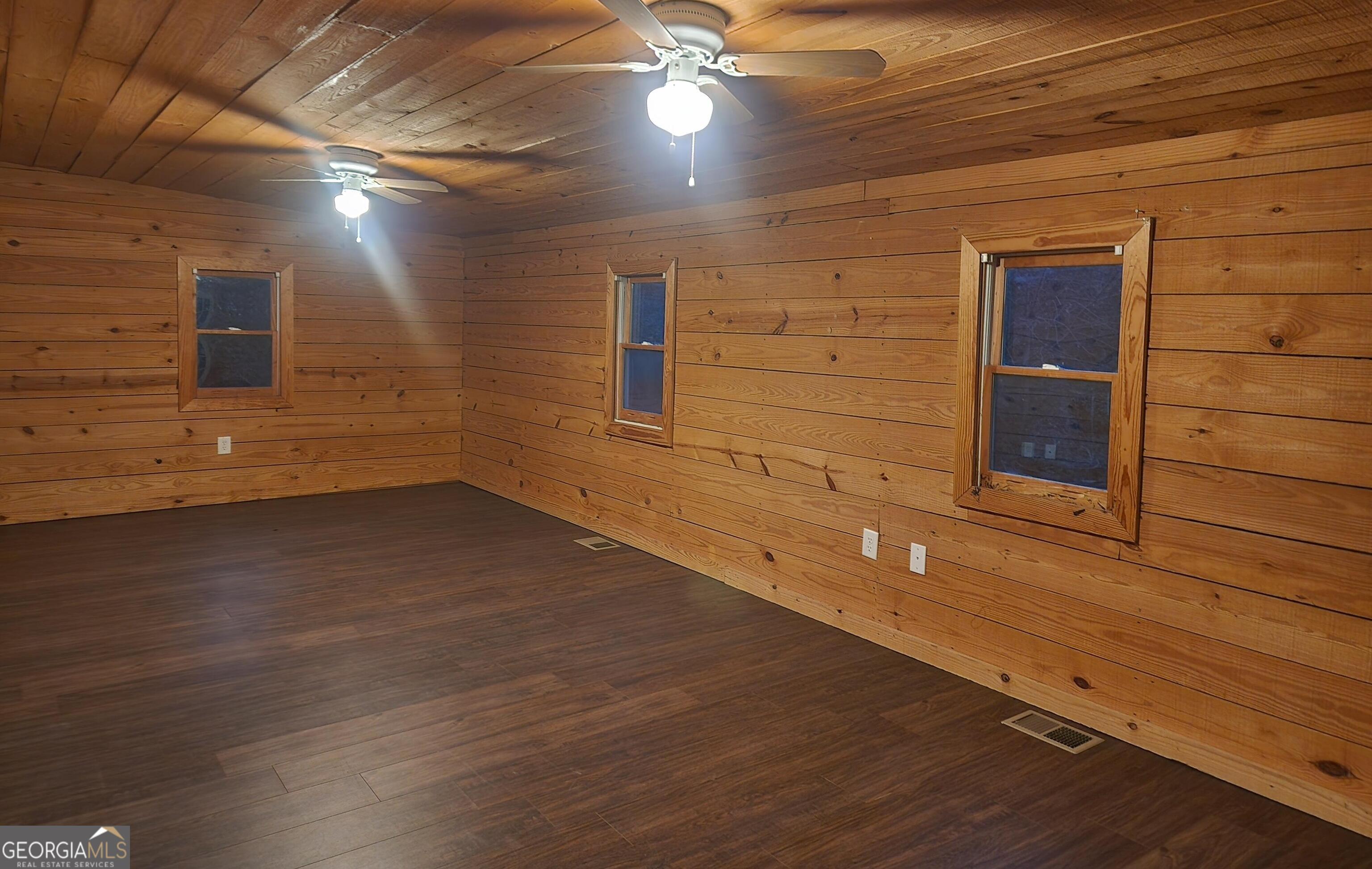 2125 Westbrook Road Commerce, GA 30530 - Photo 22 of 25 a view of an empty room with wooden floor and a window