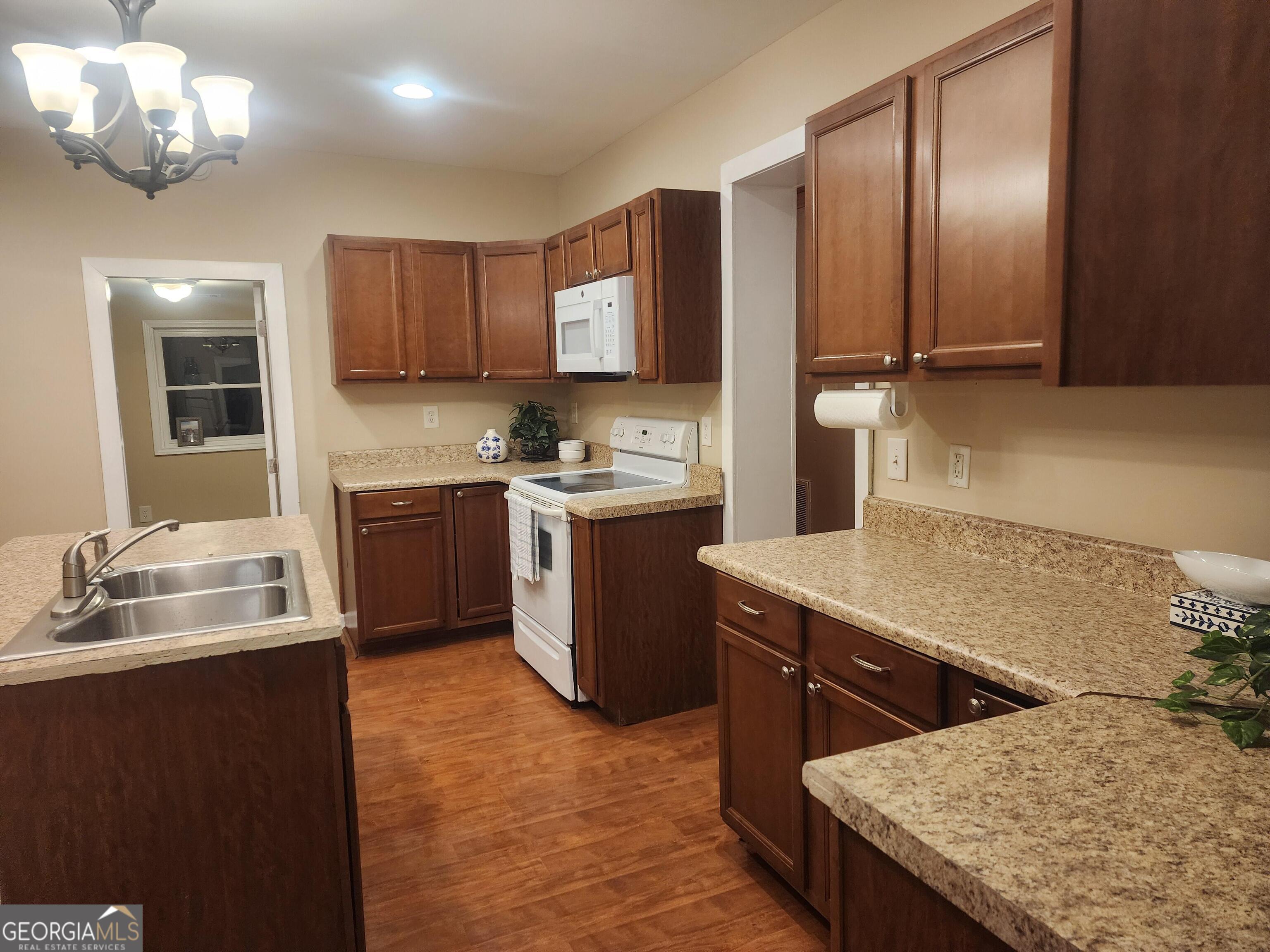 2125 Westbrook Road Commerce, GA 30530 - Photo 6 of 25 a kitchen with a sink cabinets and window