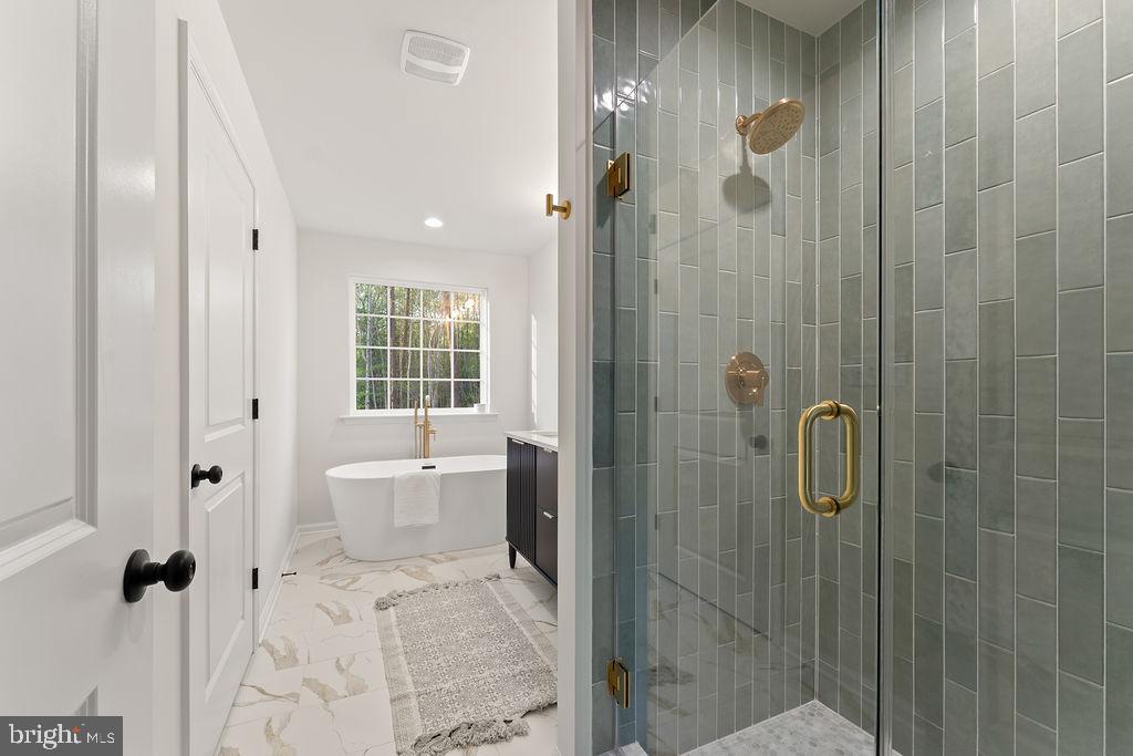 729 Vawter Corner Road Louisa, VA 23093 - Photo 19 of 50 a bathroom with a granite countertop shower