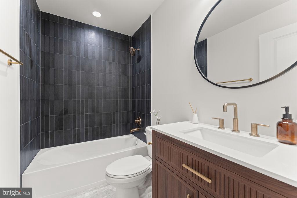 729 Vawter Corner Road Louisa, VA 23093 - Photo 24 of 50 a bathroom with a sink a toilet and shower