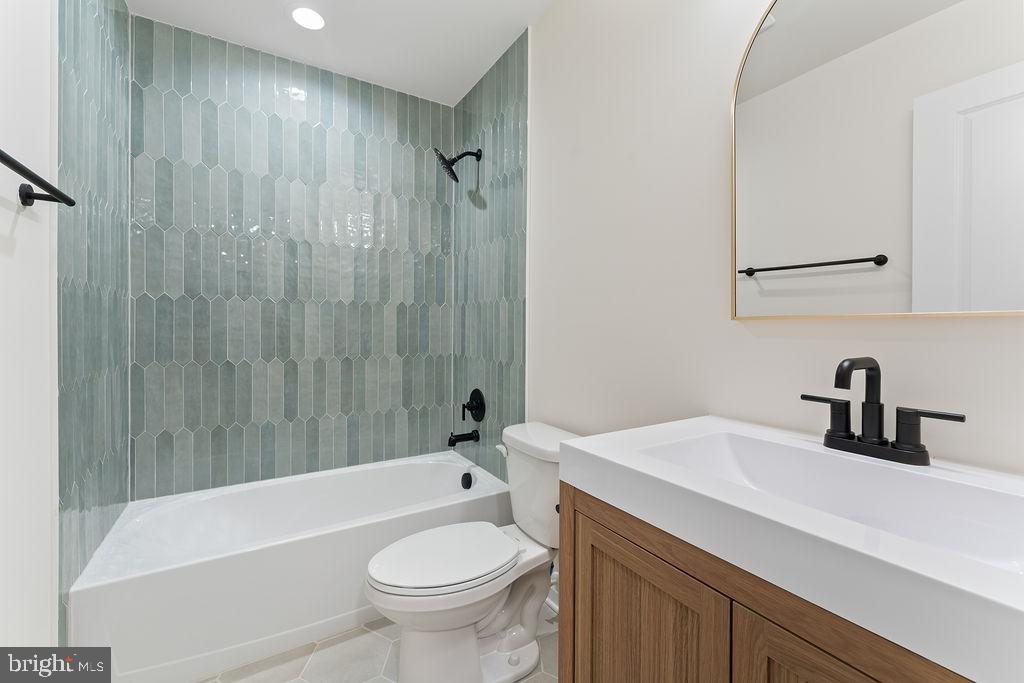 729 Vawter Corner Road Louisa, VA 23093 - Photo 32 of 50 a bathroom with a sink a toilet and a bathtub