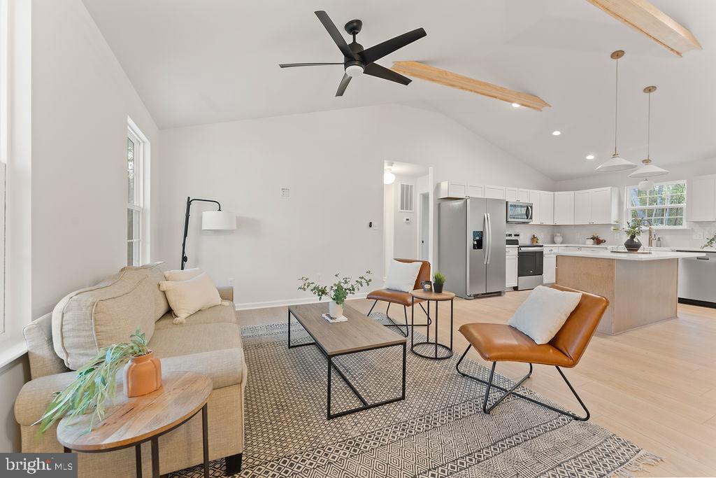 729 Vawter Corner Road Louisa, VA 23093 - Photo 4 of 50 a living room with furniture kitchen view and a chandelier
