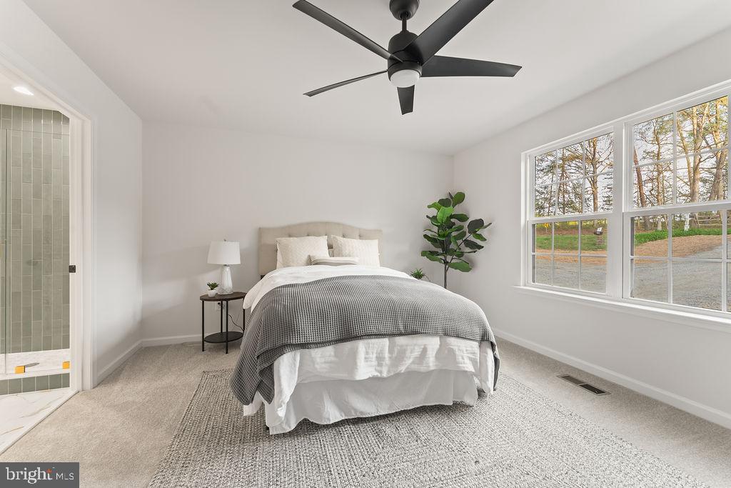 729 Vawter Corner Road Louisa, VA 23093 - Photo 41 of 50 a bedroom with a bed and a large window