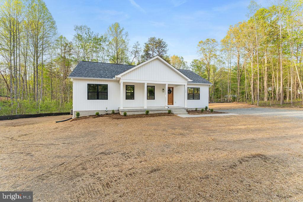 729 Vawter Corner Road Louisa, VA 23093 - Photo 43 of 50 a front view of a house with a garden