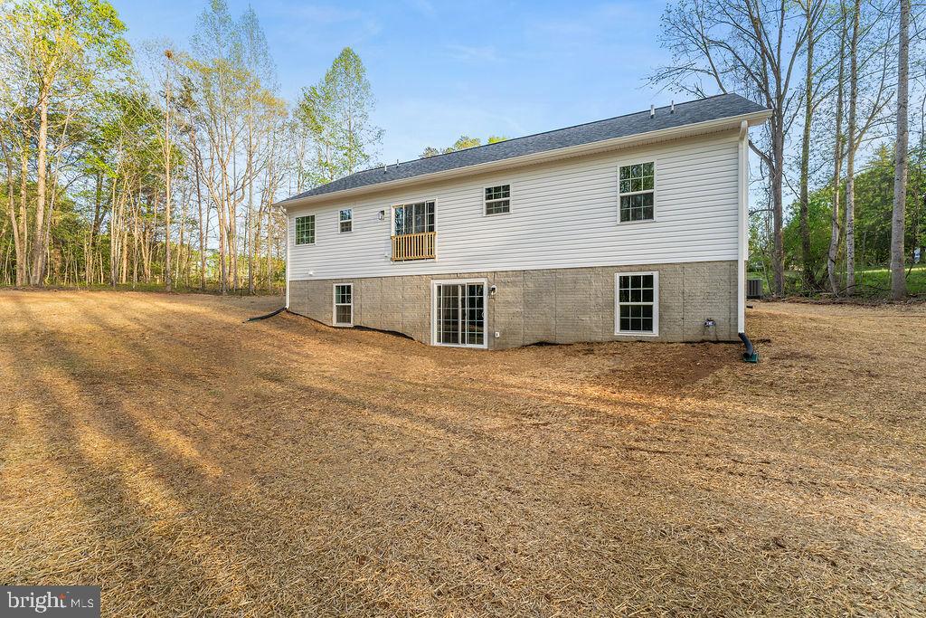 729 Vawter Corner Road Louisa, VA 23093 - Photo 46 of 50 a view of a house with a yard and garage