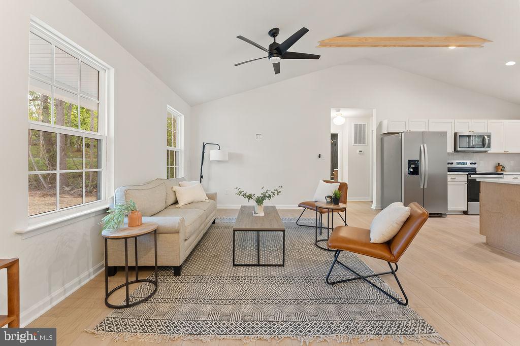 729 Vawter Corner Road Louisa, VA 23093 - Photo 5 of 50 a living room with furniture a large window and a table