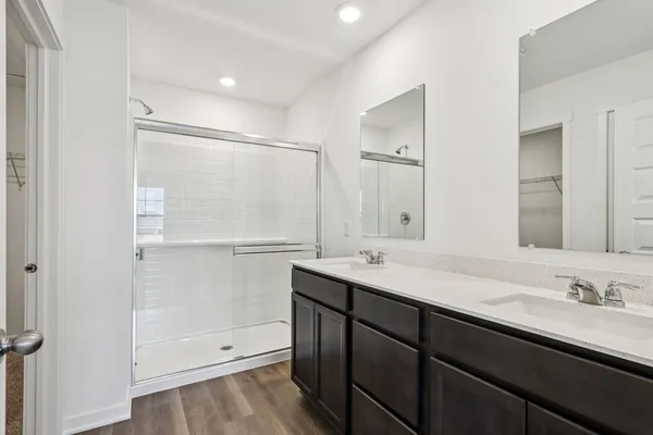 a kitchen with stainless steel appliances granite countertop white cabinets and a stove