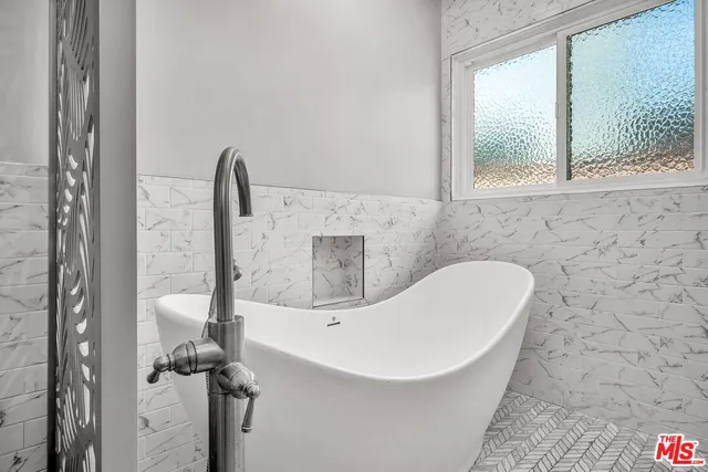 a bathroom with a sink and a bathtub