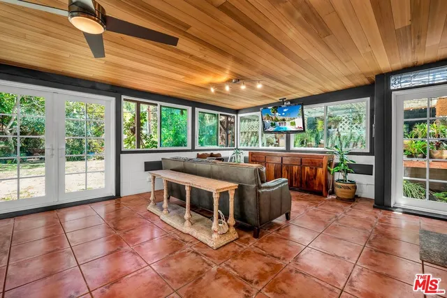 a room with furniture and a large window