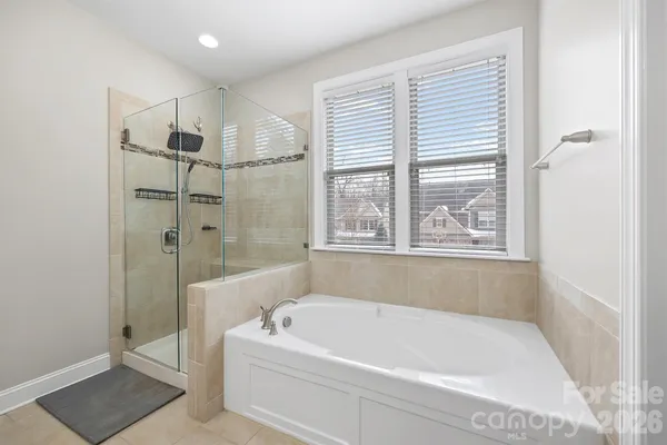 a bathroom with a toilet a sink and a mirror