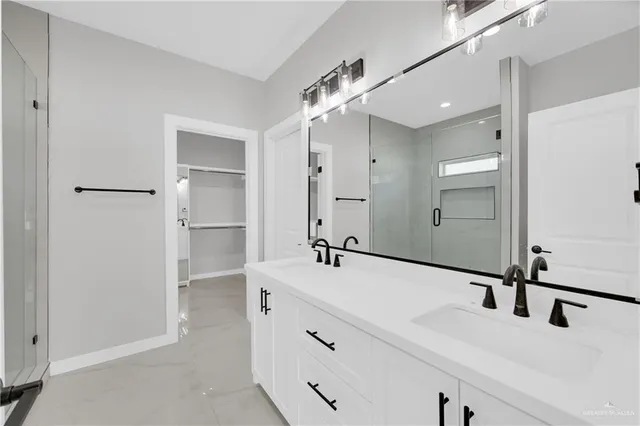 a bathroom with a double vanity sink mirror and double