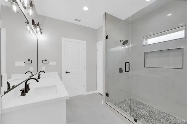 a bathroom with a sink and a shower