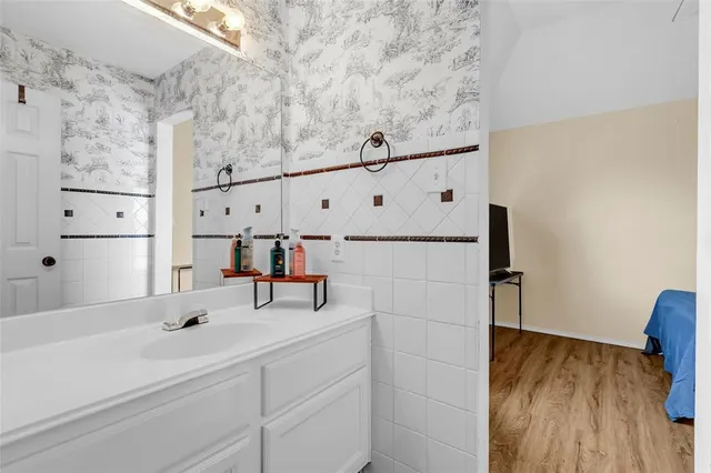 a bathroom with a sink and a mirror