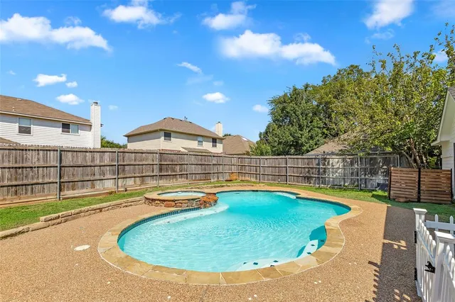 a view of a swimming pool with a lounge chairs