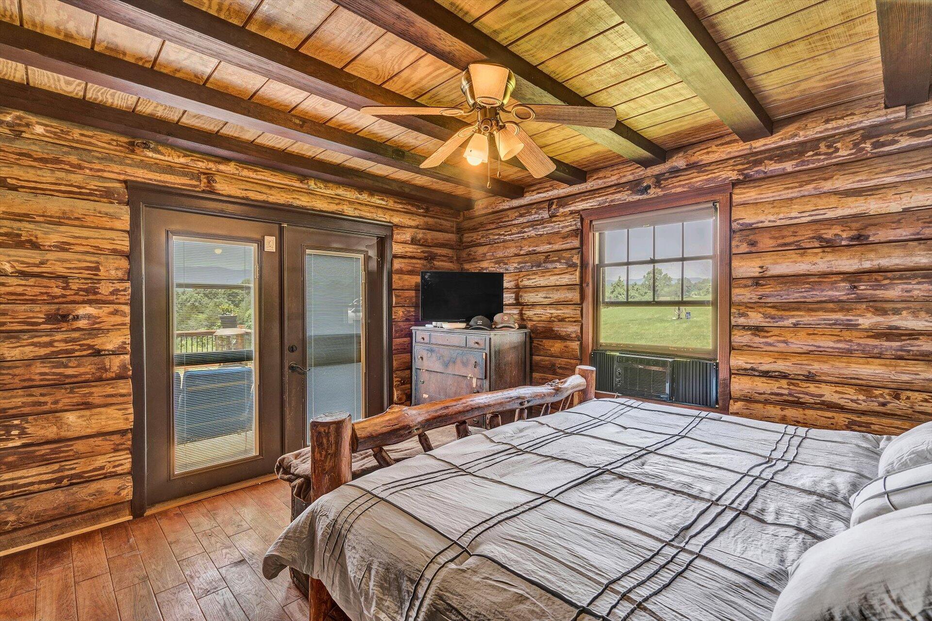 2446 Deer Run Road Ferrum, VA 24088 - Photo 22 of 146 a bedroom with a bed and a flat tv screen