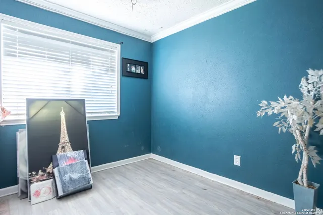 a view of a room with toys and wooden floor