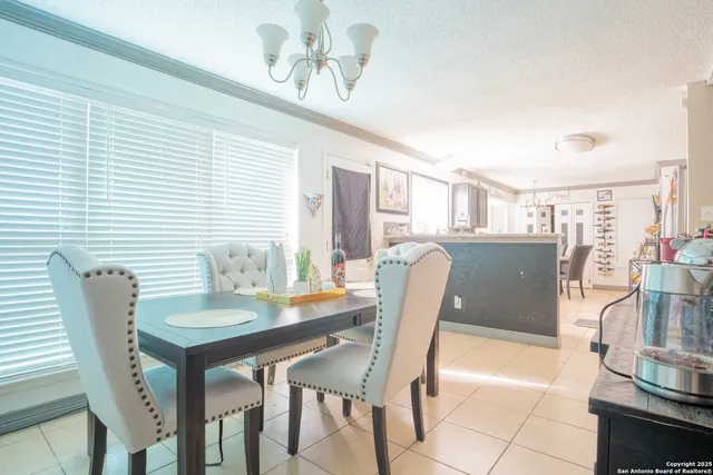 a dining room with furniture and window