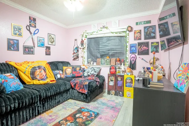 a bedroom with bed and a couch