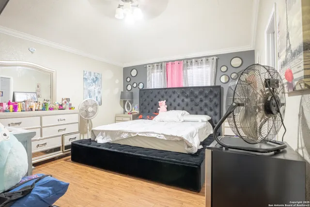 a bedroom with bed and window