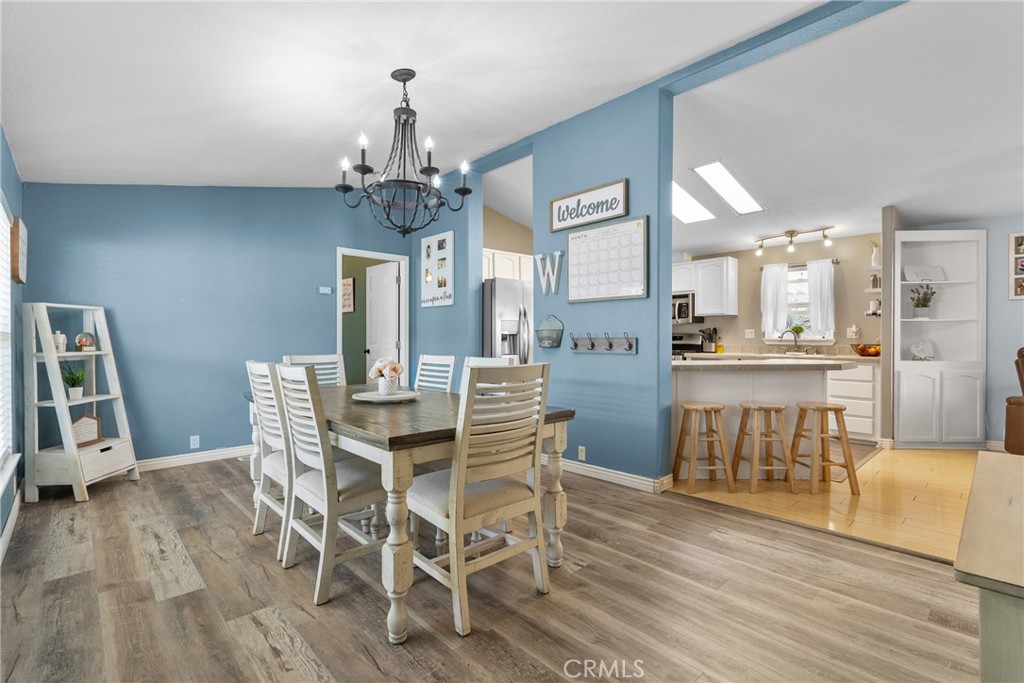 30000 Hasley Canyon Road, Unit 88 Castaic, CA 91384 - Photo 16 of 33 a view of a dining room with furniture and wooden floor
