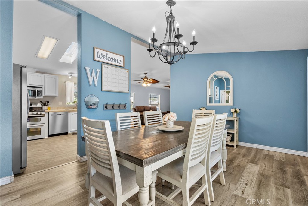 30000 Hasley Canyon Road, Unit 88 Castaic, CA 91384 - Photo 18 of 33 a view of a dining room with furniture and chandelier