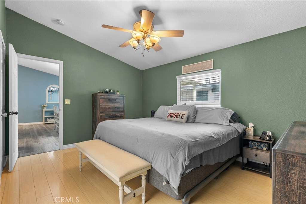 30000 Hasley Canyon Road, Unit 88 Castaic, CA 91384 - Photo 25 of 33 a bedroom with a bed table and chair