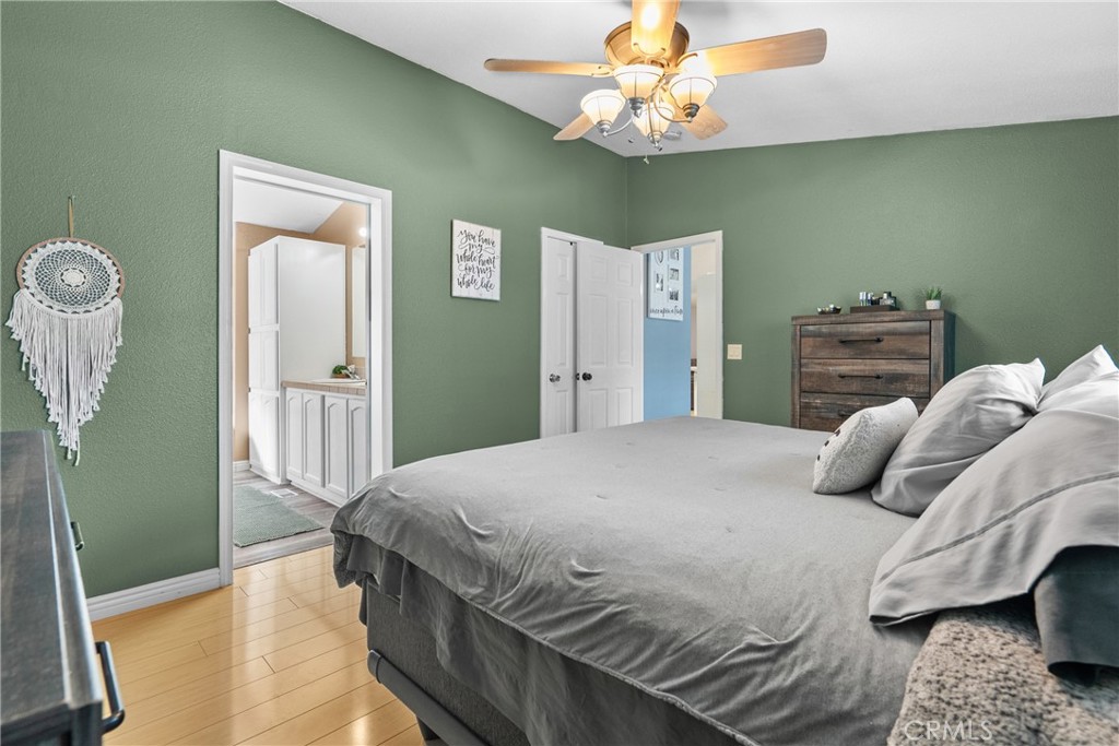 30000 Hasley Canyon Road, Unit 88 Castaic, CA 91384 - Photo 26 of 33 a bedroom with a bed and chandelier