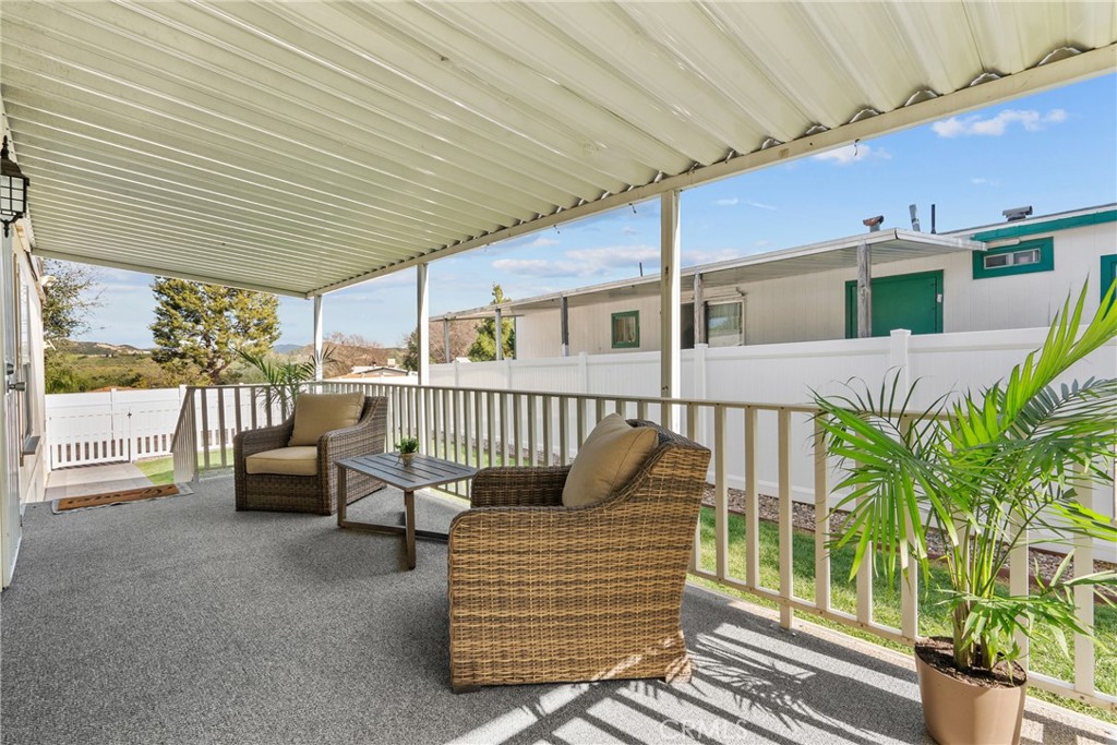 30000 Hasley Canyon Road, Unit 88 Castaic, CA 91384 - Photo 9 of 33 a view of a porch with furniture